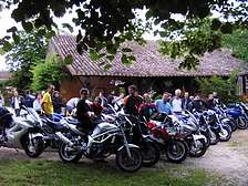 Groups hiking motorbikes rally at gites holiday resort in Dordogne Lot Gavaudun